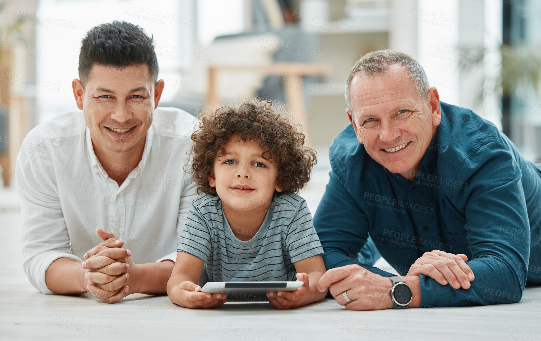 Buy stock photo Portrait, child and grandfather with dad, tablet and bonding of family, floor and watching video. Elearning, growth and development of boy, online and reading of ebook, old man and father in house