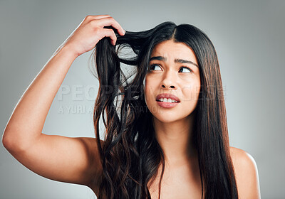 Buy stock photo Woman, hair care and thinking with damage in studio, stress and solution with split ends by background. Girl, model and frustrated with fail, change and texture with mess, crisis and cosmetics