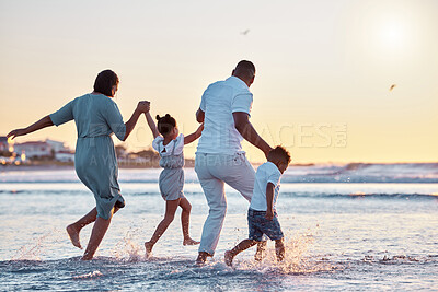 Buy stock photo Parents, running or children at beach for sunset, holiday or travel on break with boy, girl or family. Playing, mother or father with kids at sea on vacation together for wellness, water or nature