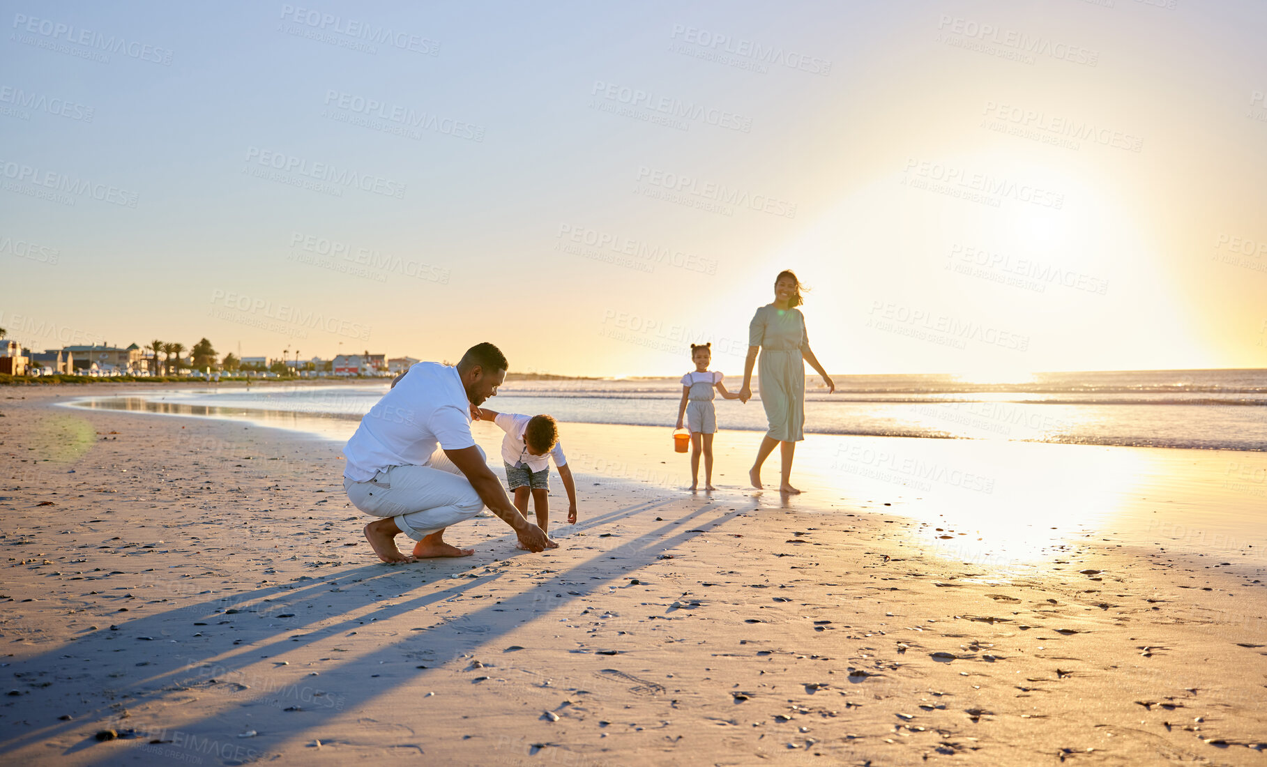 Buy stock photo Parents, sandcastle or children at beach for playing, holiday or travel on break with boy, girl or family. Bonding, mom or father with kids at sea on vacation together for games or sunset to relax