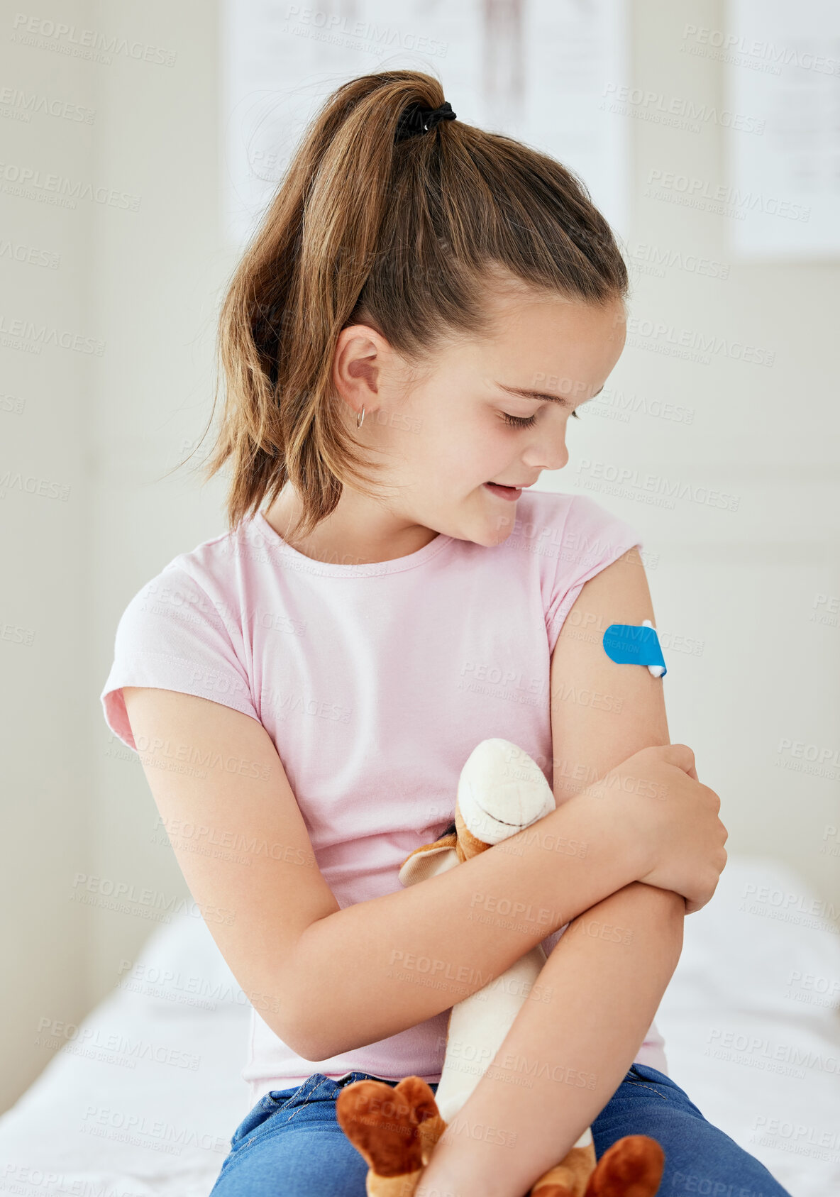 Buy stock photo Girl, child and hospital plaster for vaccine, stuffed animal and bandage for virus treatment. Female person, teddy bear and immunization booster in pediatrician clinic for trust in flu shot