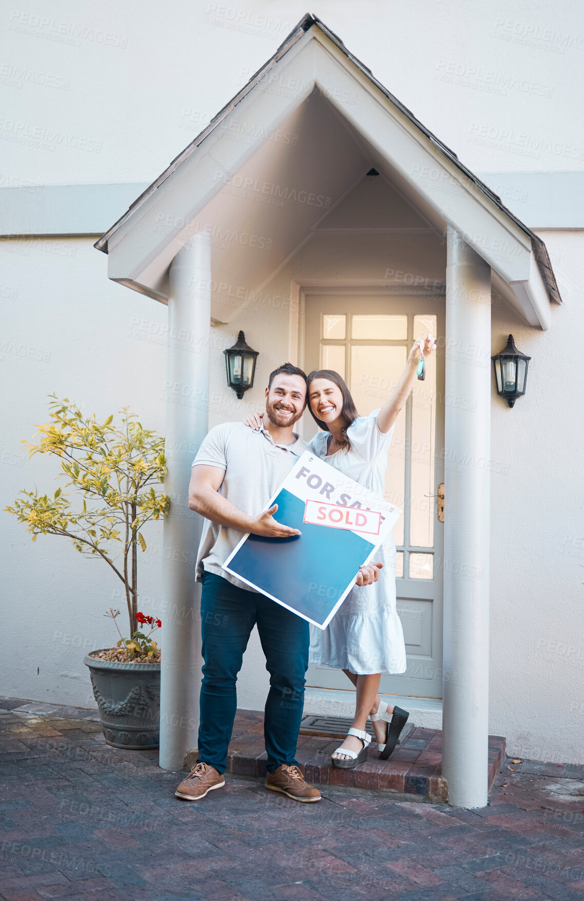 Buy stock photo Portrait, keys and happy couple with sign for new home, sale and investment loan. Real estate, man and woman with sold property, mortgage and celebrate moving to dream house for relocation outdoor