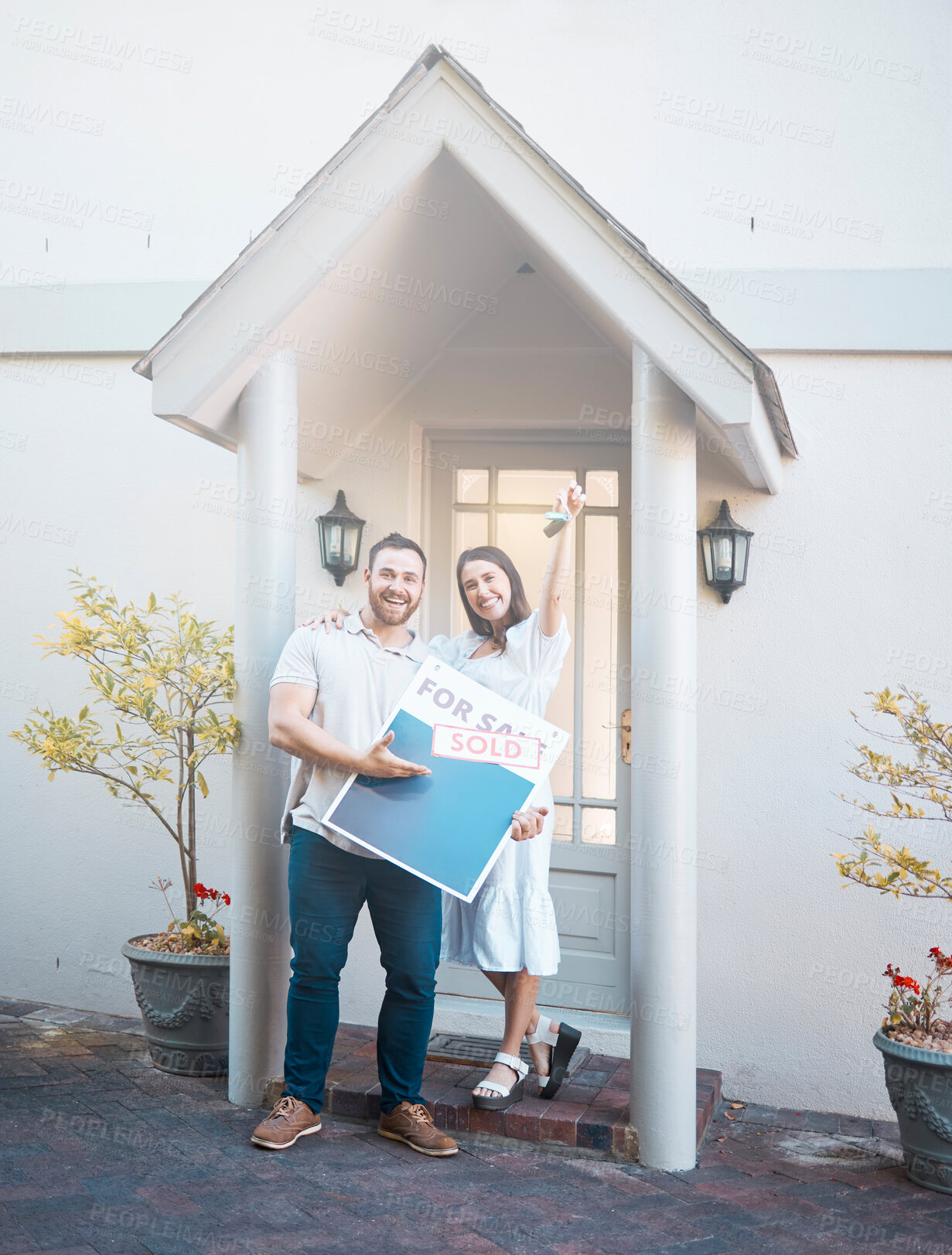 Buy stock photo Portrait, keys and happy couple with sign for real estate, sale and investment loan. New home, man and woman with sold property, mortgage and celebrate moving to dream house for relocation outdoor