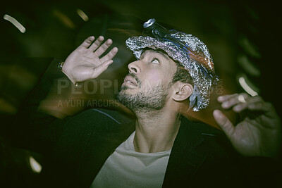 Buy stock photo Helmet, night and man with fear for depression, anxiety or mental disorder with schizophrenia. Confused, mentally ill or paranoid person in city with hallucinations or stress in hardhat with foil