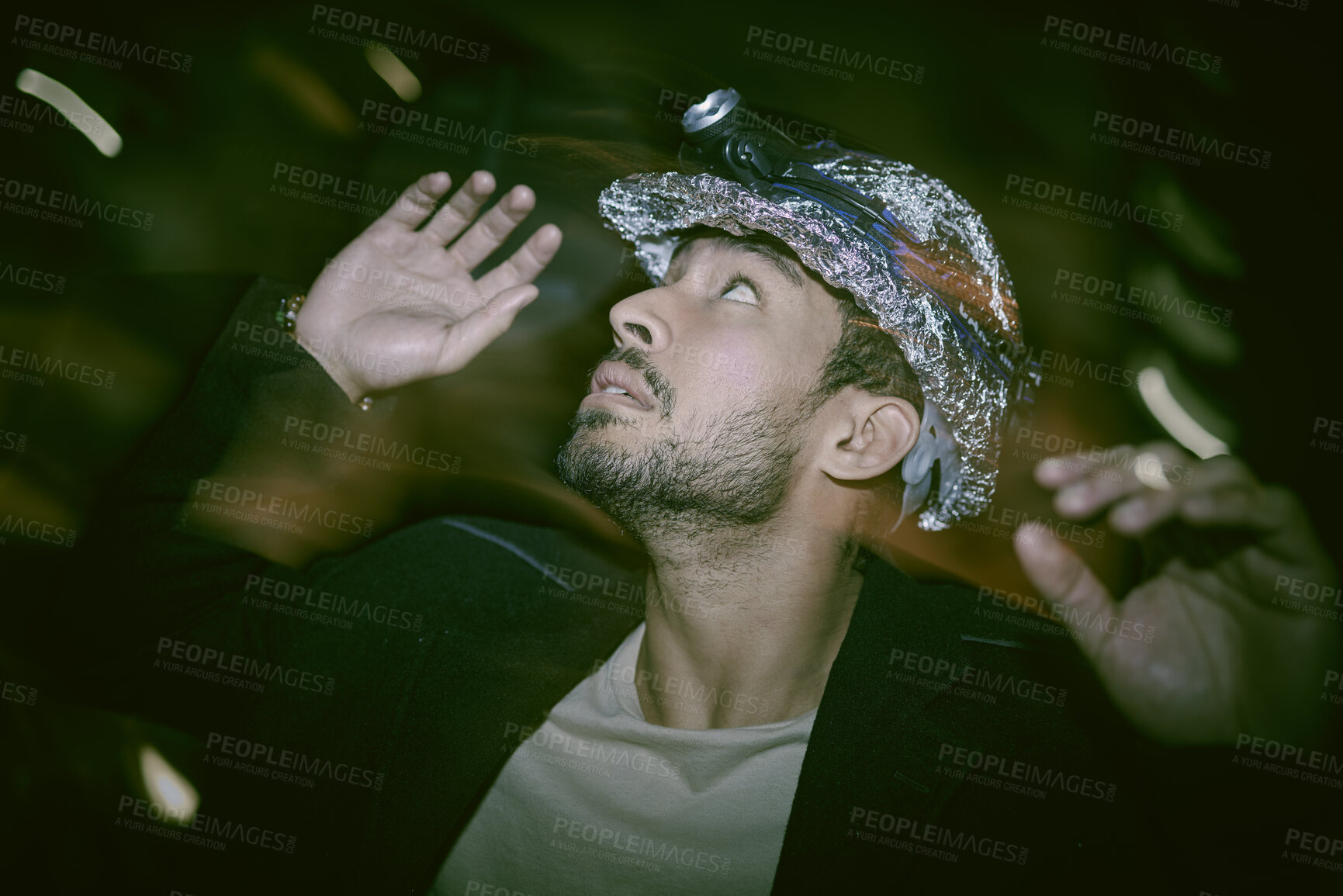 Buy stock photo Helmet, night and man with fear for depression, anxiety or mental disorder with schizophrenia. Confused, mentally ill or paranoid person in city with hallucinations or stress in hardhat with foil