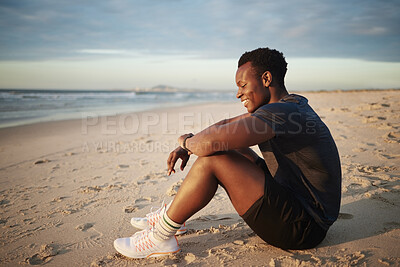 Buy stock photo Fitness, black man and break by beach at sunset for outdoor sports exercise, wellness pr rest on sand. Male person, athlete and happy with smile by ocean water for summer workout, evening or training