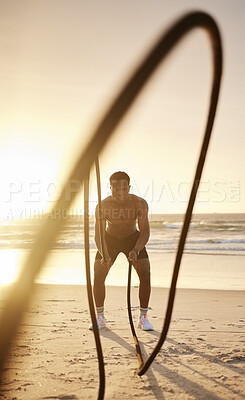 Buy stock photo Fitness, exercise and black man with rope at beach for strength training, endurance and cardio. Topless, male athlete and sunset with arm workout by ocean waves for muscle, challenge and intensity