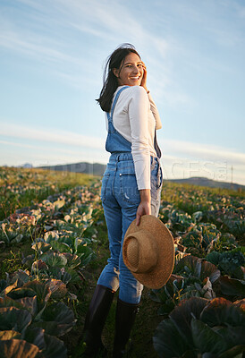 Buy stock photo Field, farm and portrait of woman in nature for environment, agro business and eco friendly gardening. Happy, countryside and person with vegetables growing for agriculture, produce and ecology