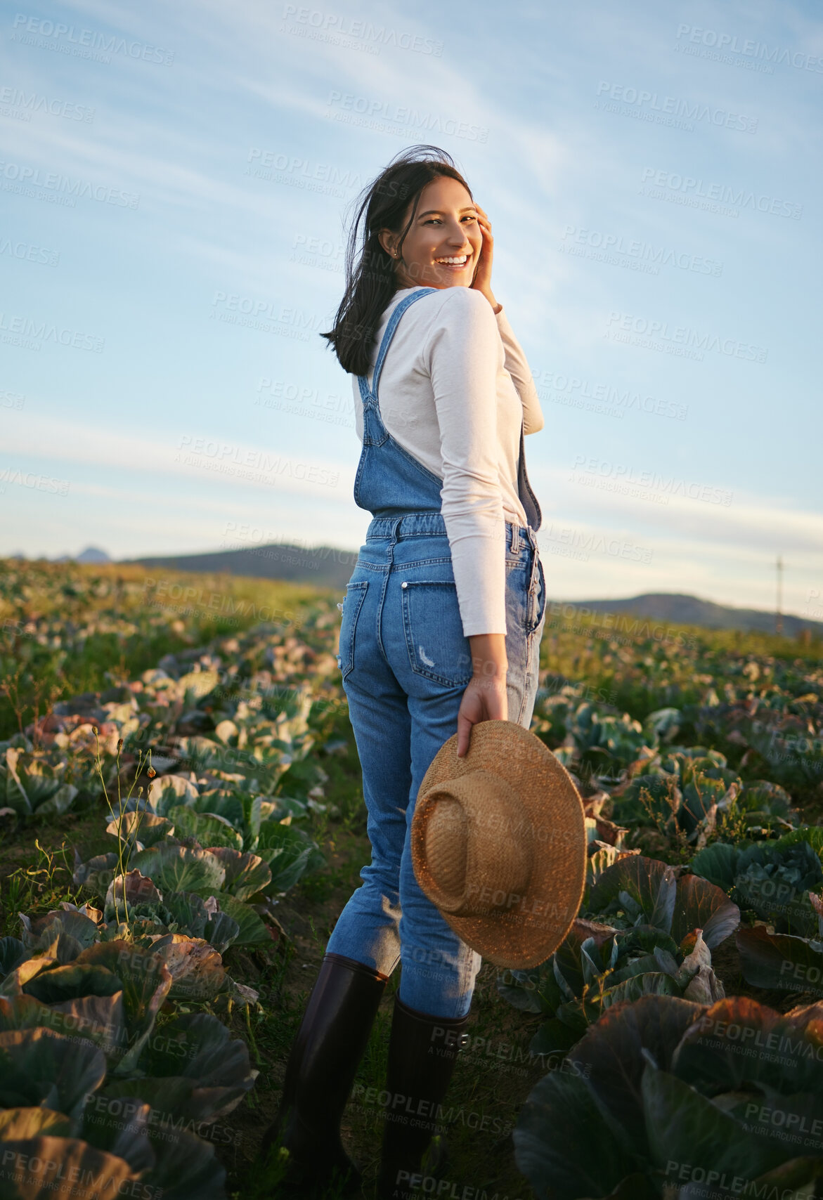 Buy stock photo Field, farm and portrait of woman in nature for environment, agro business and eco friendly gardening. Happy, countryside and person with vegetables growing for agriculture, produce and ecology