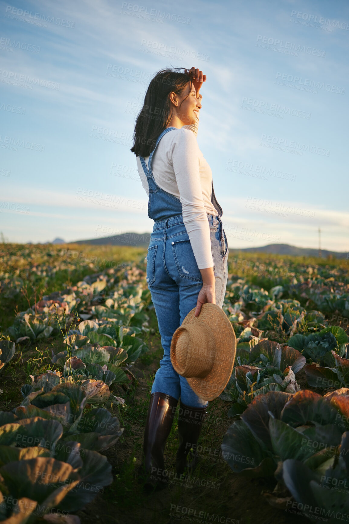 Buy stock photo Relax, farming and woman in field with plants, growth and sustainable business in agriculture from back. Nature, peace and girl farmer in agro food production, harvest and development in countryside.