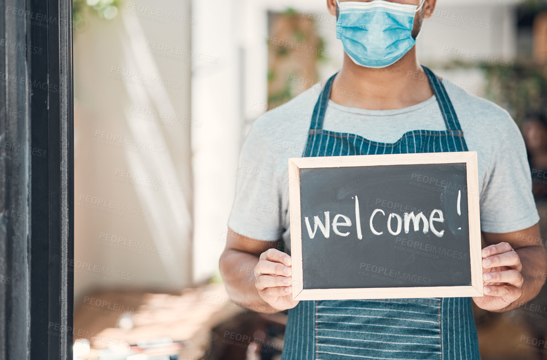 Buy stock photo Hands, waiter and coffee shop with welcome sign or poster in small business, cafe or bistro. Male person, hospitality and industry as barista, entrepreneur or employee with mask as restaurant staff