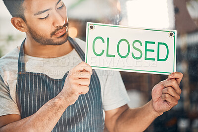 Buy stock photo Closed, entrepreneur and man with sign, glass and sad for bankruptcy of small business and serious. Store, door and person in hospitality, window and message on entrance, apron and waiter in cafe