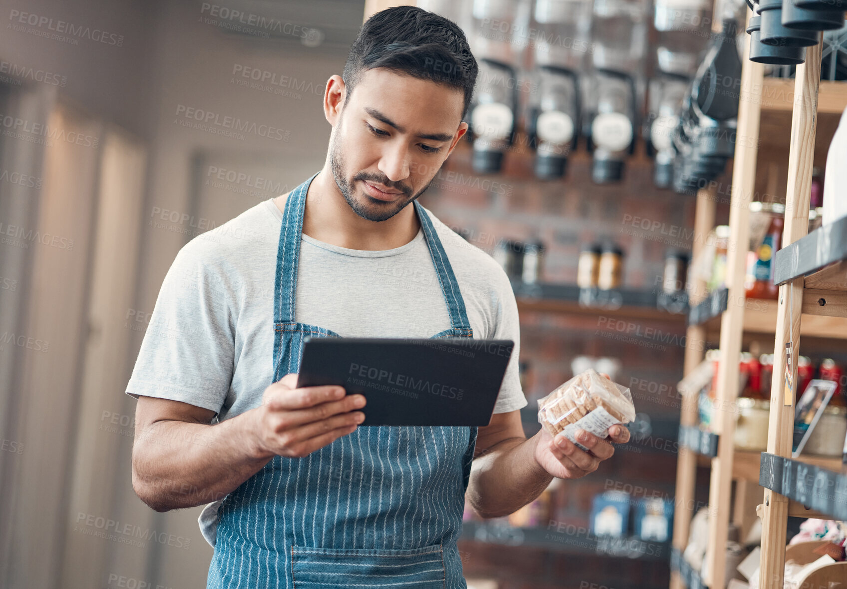 Buy stock photo Man, waiter and coffee shop with tablet, inventory and quality control for small business or bistro. Male person, technology and stock management as barista, entrepreneur and employee in restaurant