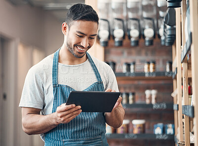 Buy stock photo Small business, asian man and smile in cafe with tablet, product check and scroll for inventory management. Coffee shop, manager and barista with digital for stock quality, startup or online services