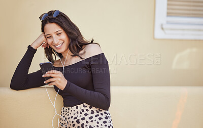 Buy stock photo Woman, earphones and travel with phone in city for outdoor adventure, holiday and listening to music. Smile, sunglasses and female person with technology by building for journey, playlist or vacation