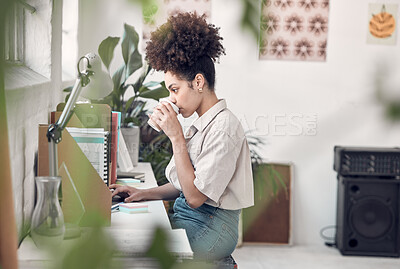 Buy stock photo Coffee, computer and remote work with woman in home office for design, planning or research. Desk, drink and web development with African freelance employee in apartment for small business startup