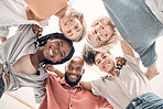 Low portrait of a group of five cheerful diverse businesspeople standing together in an office at work. Happy business professionals standing at work. Colleagues huddling together in support and motivation