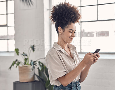 Buy stock photo Woman, phone and happy for texting at startup, office or reading notification on break at media company. Person, smartphone and smile for chat, scroll or app on social network at creative agency