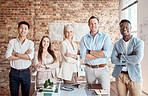 Group of diverse architects discussing plans, blueprints and schematics during a meeting in their office boardroom. Business people brainstorming and planning their upcoming project development