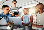 Group of diverse businesspeople having a meeting in an office at work. Business professionals talking in an office. Young african american businesswoman explaining a plan to her colleagues