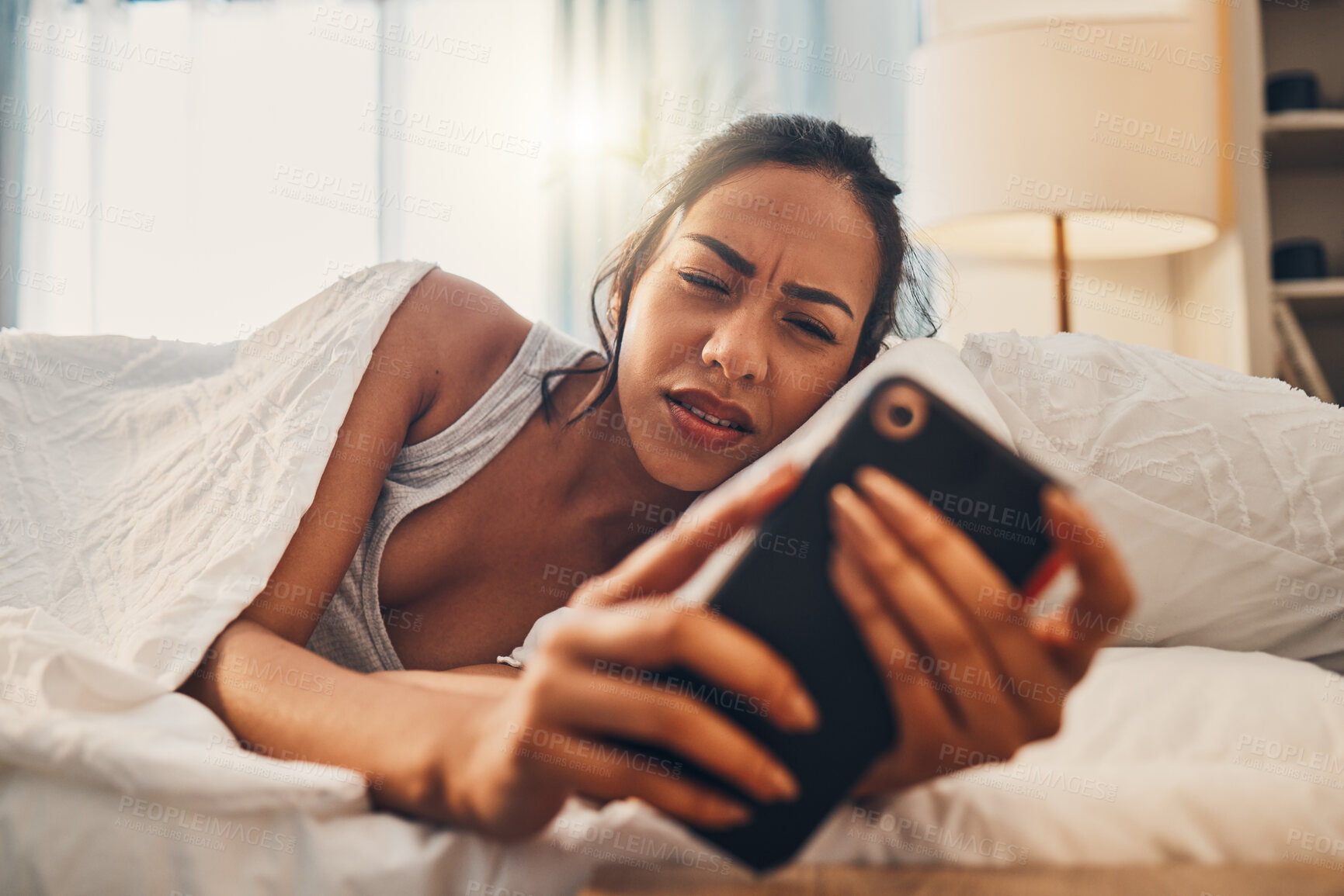 Buy stock photo Waking up, annoyed and woman with smartphone, bed and confused with bank charges and notification. Bedroom, reading and email for increase of interest rate, unhappy and person with mobile in house