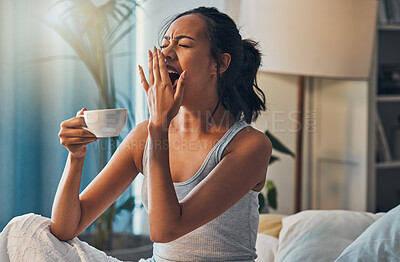 Buy stock photo Coffee, wake up and yawn with woman in bed of home for morning or weekend caffeine beverage. Exhausted, fatigue or tired with person in bedroom of apartment or hotel for break, relax and rest