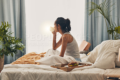 Buy stock photo Woman, relax or breakfast with coffee in bed for morning, meal or snack in comfort at home. Young, female person or awake with cup of caffeine or tray in bedroom for food, drink or nutrition at house