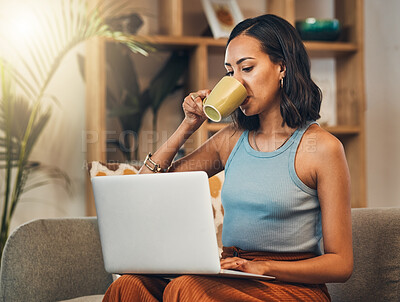 Buy stock photo Blogging, coffee and laptop with woman on sofa in living room of home for remote work or research. Computer, drink and typing with blogger person in apartment for edit or publish article online