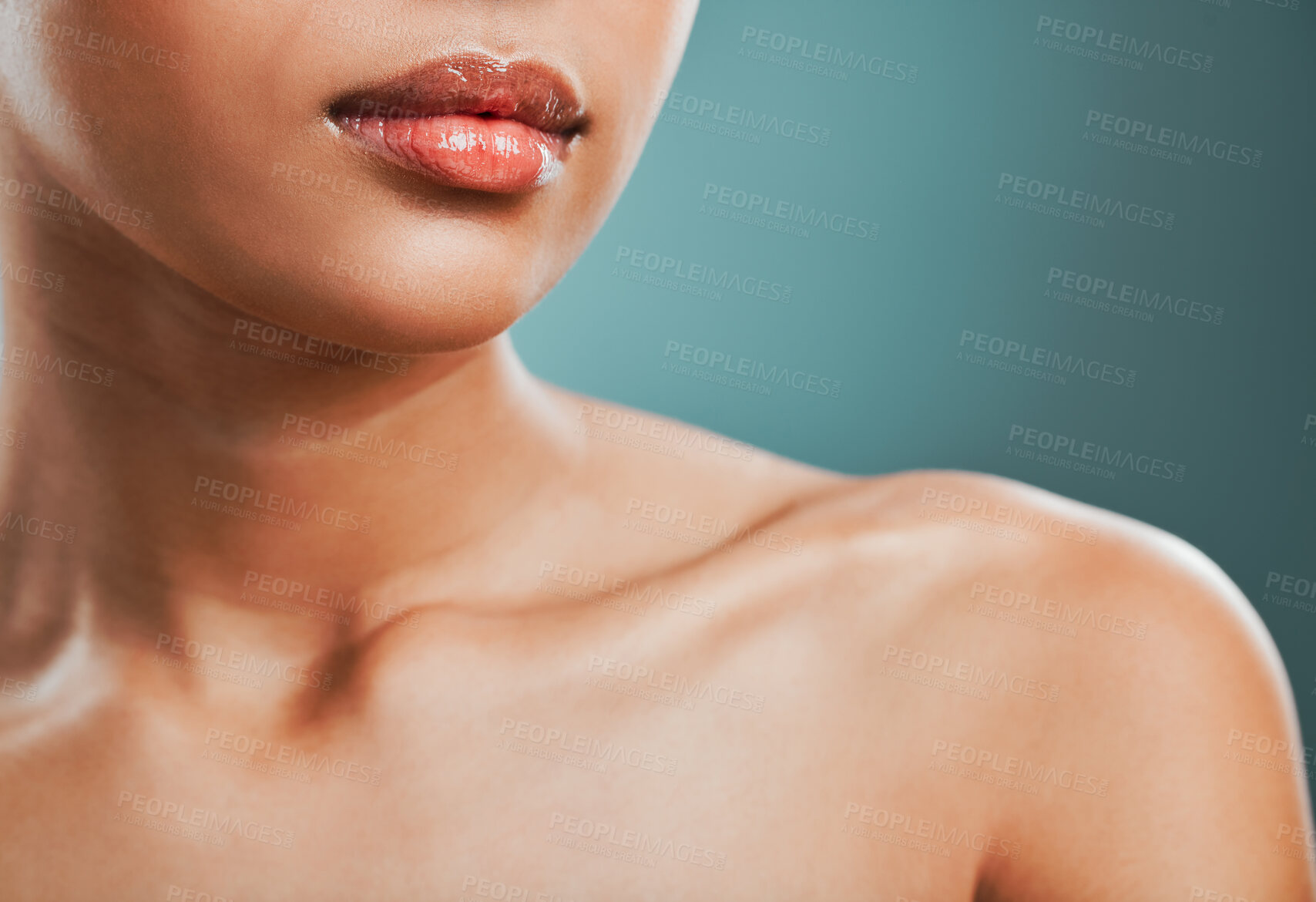 Buy stock photo Beauty, collarbone and dermatology with woman in studio isolated on blue background for hygiene closeup. Body, skincare and lips with glow, model person at salon or spa for natural cosmetic treatment