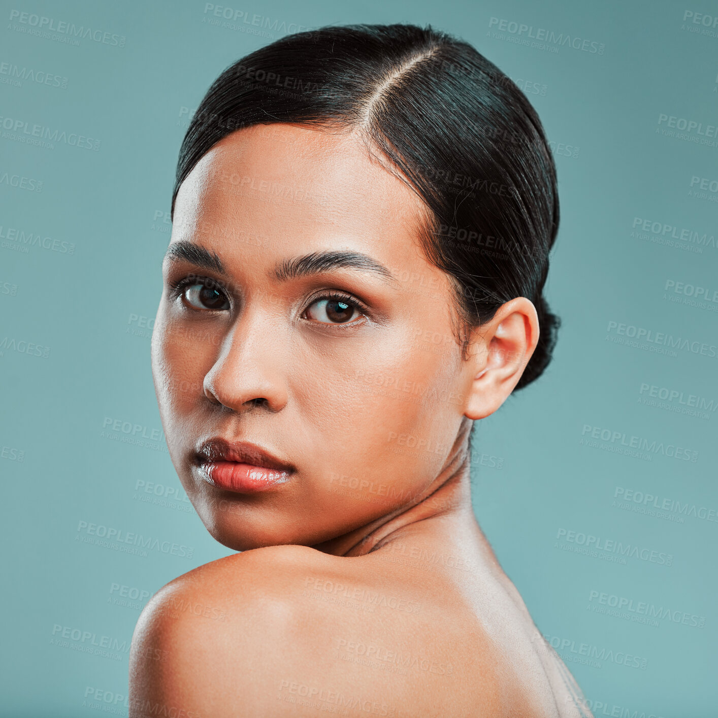 Buy stock photo Confident, portrait or woman with beauty, makeup or glow on face in studio on blue background. Cosmetics treatment, elegant or girl model with facial health for wellness, shine or pride in France