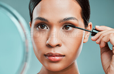 Buy stock photo Mascara, mirror or woman with beauty, makeup or skincare glow in studio on blue background. Cosmetics brush, application or confident girl model with eyelash extensions for volume or length in France