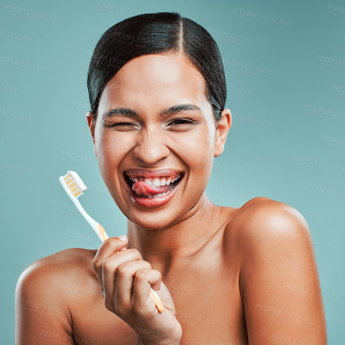 Buy stock photo Woman, toothbrush and wink on studio background for portrait, dental care and gum health. Girl, brush or toothpaste for oral hygiene with positive attitude, plaque removal or healthy mouth protection