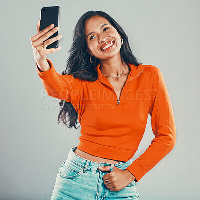 Buy stock photo Influencer, selfie or happy woman with fashion in studio for vlogging, social media or blog by gray background. Smile, model and girl taking picture for photography and post online for trendy style