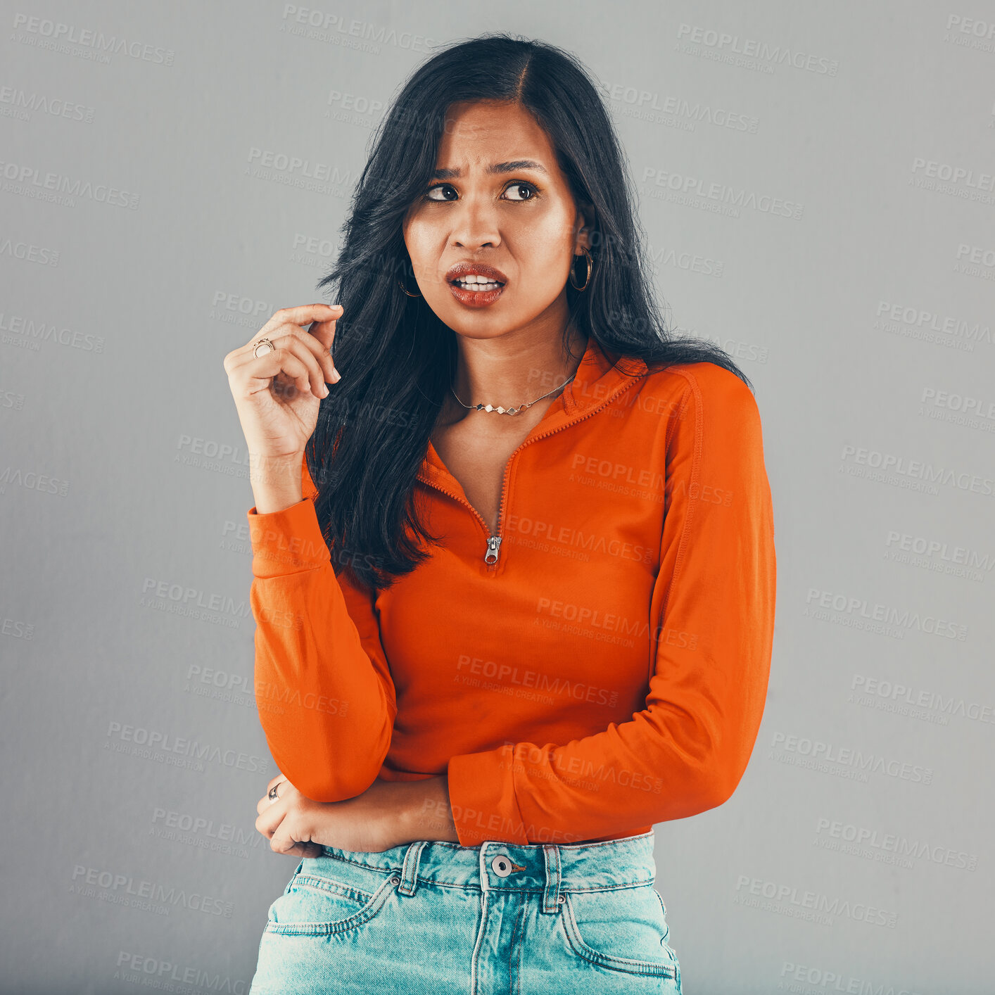 Buy stock photo Thinking, frustrated and annoyed woman in studio for opinion, review or shocked with decision. Anger, doubt and confused girl with stress, omg or drama crisis with expression on grey background