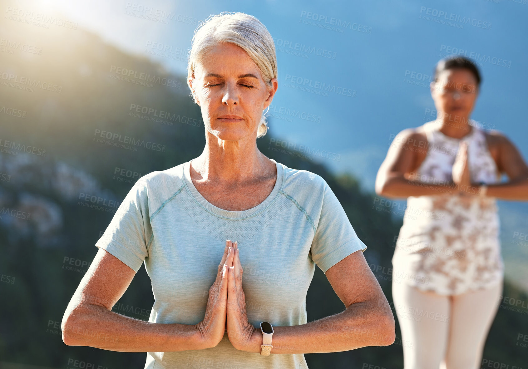 Buy stock photo Yoga, namaste and woman meditate in nature for fitness, body health or peace with class. Spiritual, calm and mature person with prayer hands for breathing exercise, zen and mindfulness for wellness