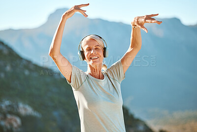 Buy stock photo Senior, happy woman or dancing with headphones on mountain for music, peace or tranquility in nature. Mature, female person or yogi with smile or headset for outdoor freedom, listening or zen podcast