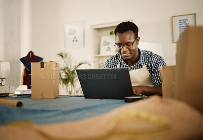 Buy stock photo African man, laptop and smile for tailor, small business owner and clothing workshop. Designer, ecommerce and fashion product for boutique, retail and shopping startup for creative industry or store