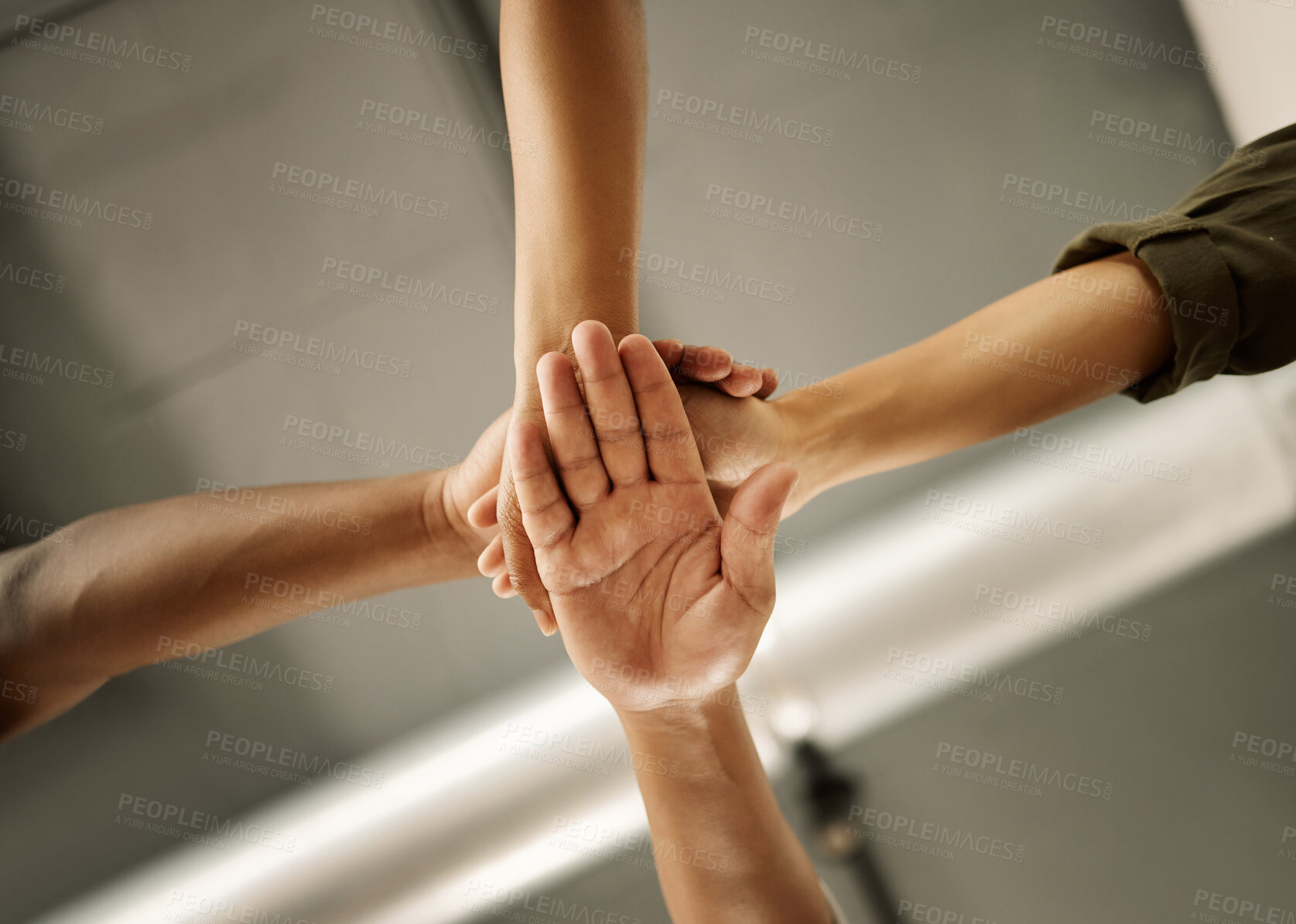 Buy stock photo Fashion, below and hands of people in huddle for group mission, support and startup together. Workshop, low angle and designers with gesture for manufacturing industry, textile production or teamwork