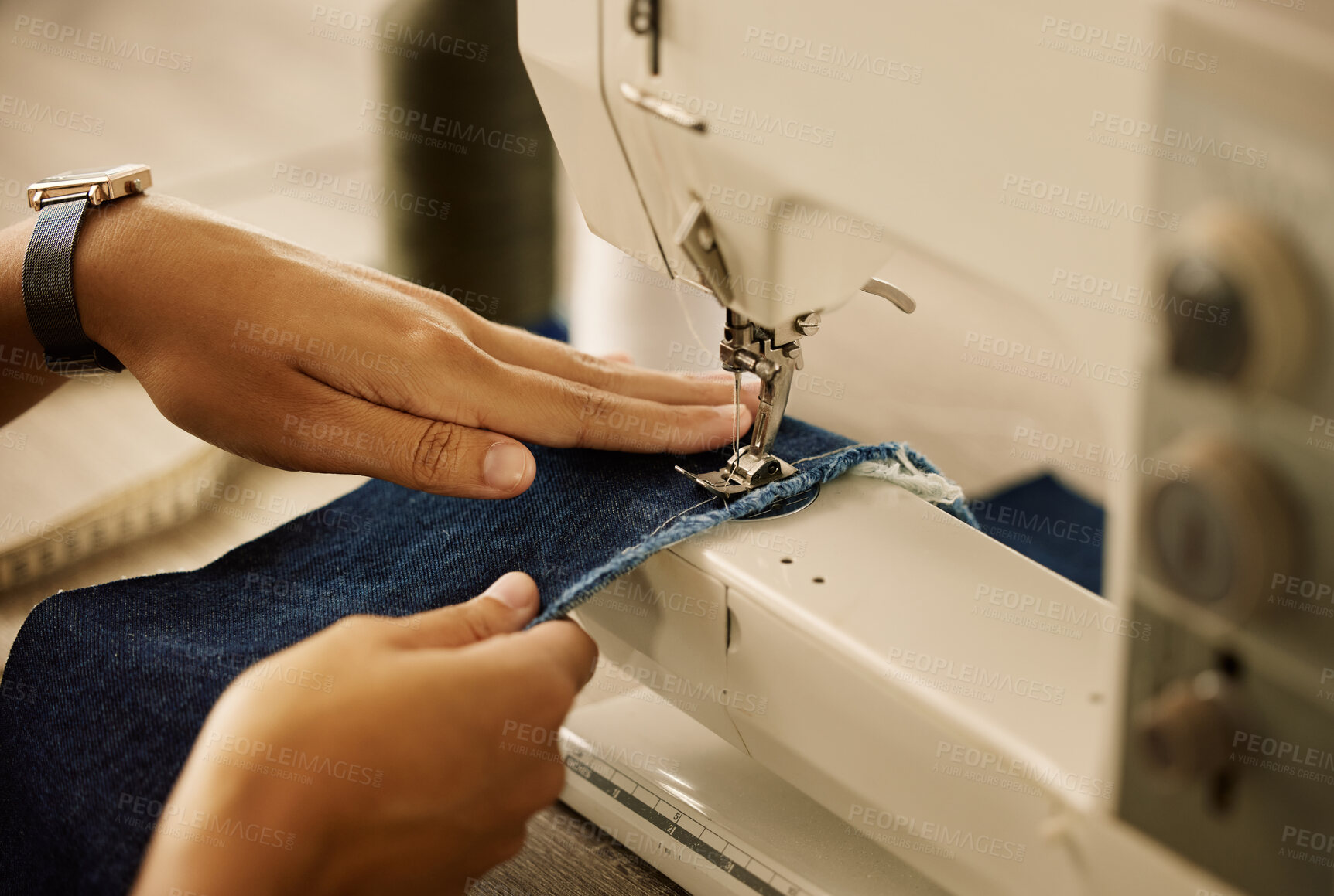 Buy stock photo Hands, person and sewing machine with denim in workshop, creativity and manufacturing industry. Small business, tailor or designer with equipment for pattern, fashion production and stitch by closeup