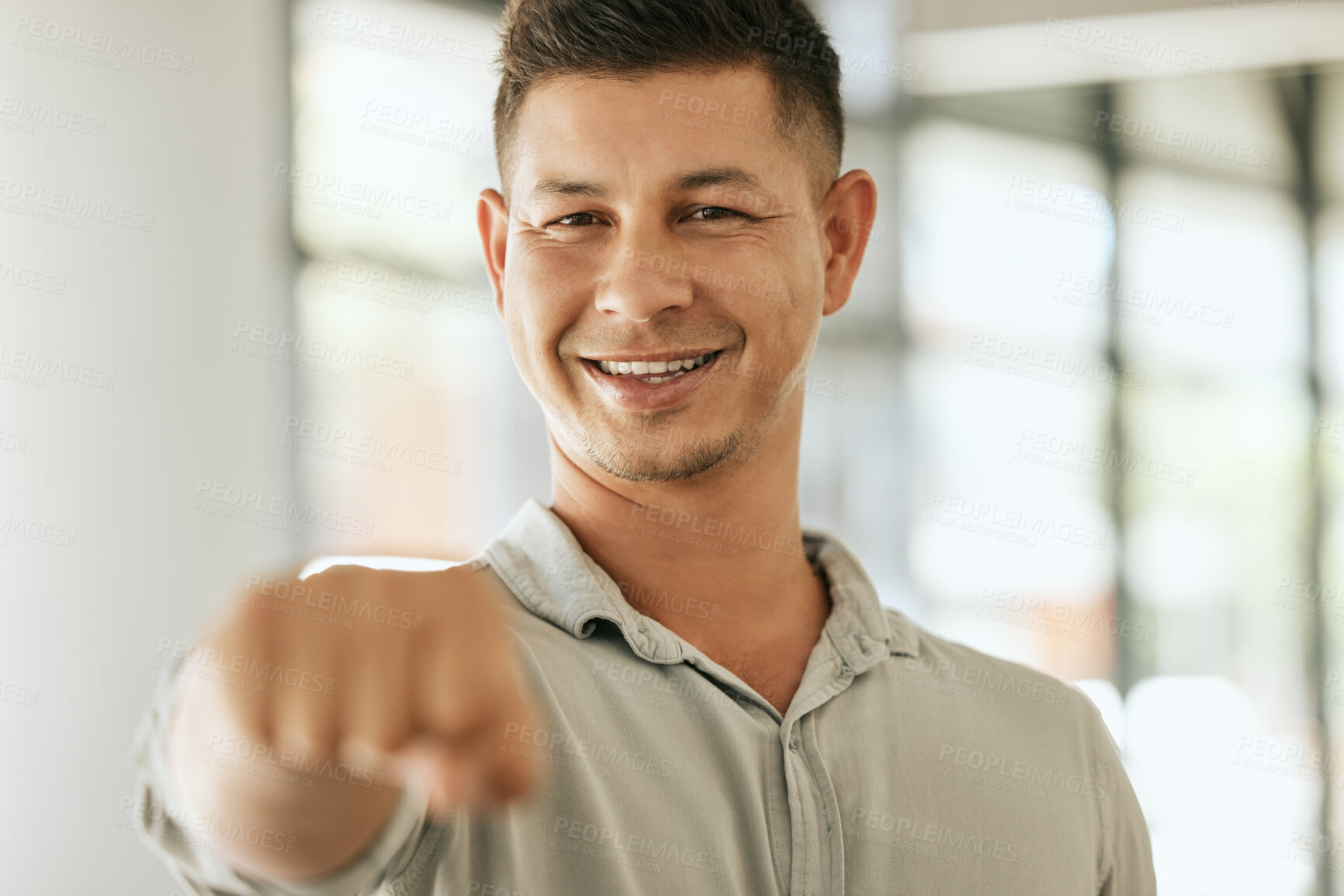 Buy stock photo Happy, portrait and businessman with fist bump for collaboration, meeting or greeting at office. Young, male person or employee with smile, gesture or emoji for teamwork or well done at workplace