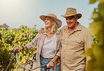 Buy stock photo Smile, mature couple and walk in vineyard for countryside, travel and holiday with bicycle. Senior people outdoor, adventure and bonding for retirement together with vacation, tour and sightseeing