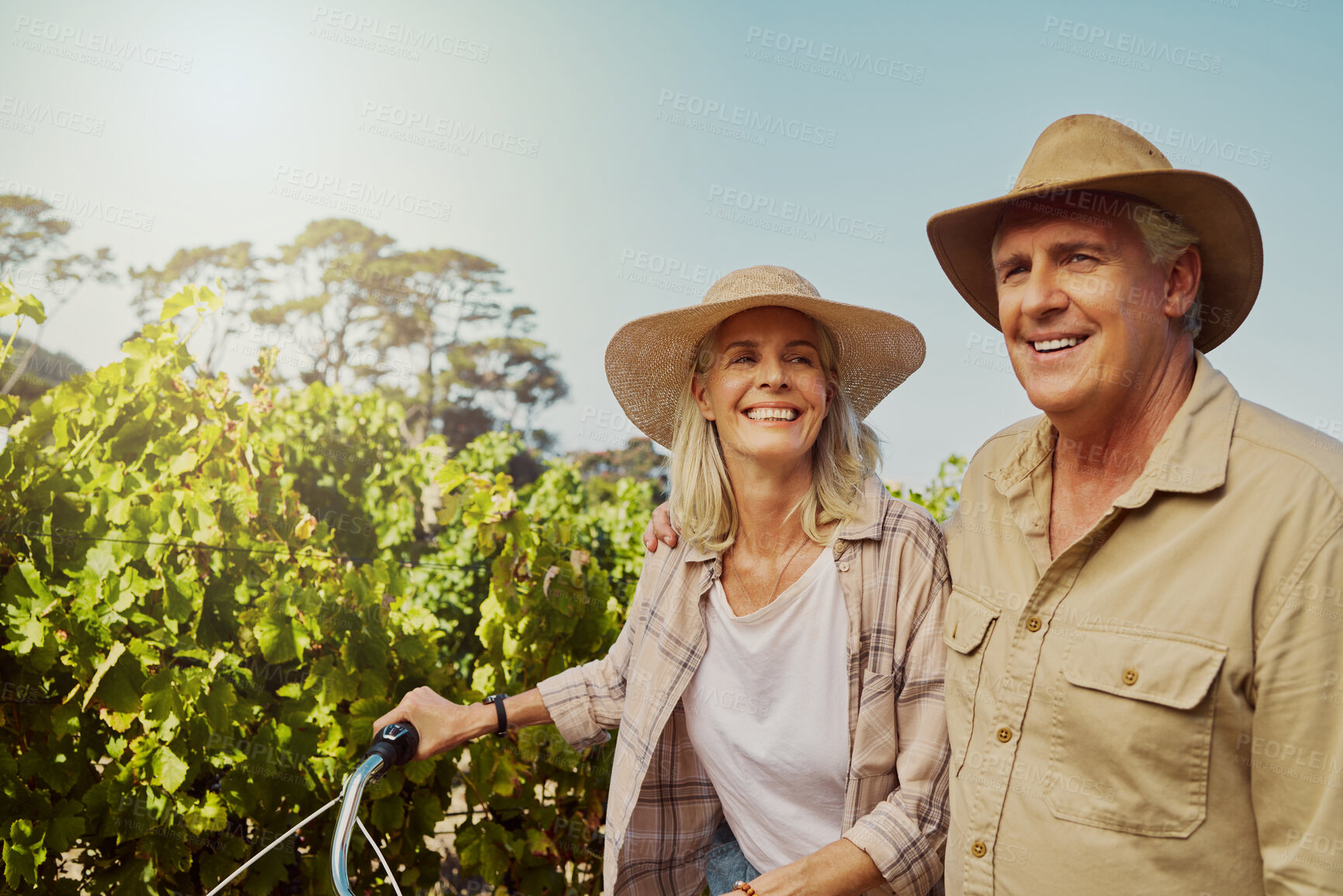 Buy stock photo Smile, senior couple and walk in vineyard for countryside, travel and holiday with bicycle. Mature people outdoor, adventure and bonding for retirement together with landscape, tour and sightseeing