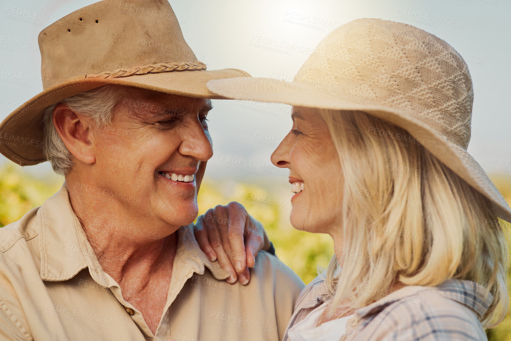 Buy stock photo Couple, happy and love with hug in nature for relationship, holiday and bonding together on date with smile. Mature, people and travel to countryside farm for romance, vacation and embrace with relax