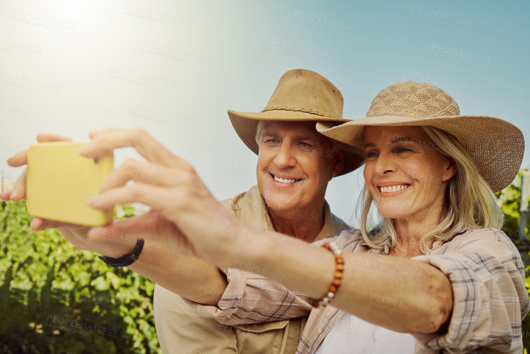 Buy stock photo Couple, love and selfie in nature for relationship, holiday and bonding together on date with smile. Mature people, memory and photography on countryside farm for romance, vacation and social media