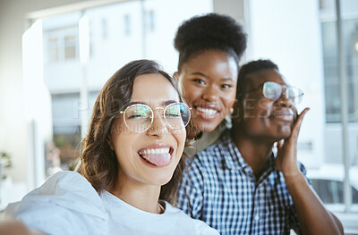 Buy stock photo Business people, funny face and team with selfie for photography, picture or humor together at office. Young group, friends or employees with smile for capture, moment or fun memory at workplace