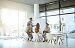 Group of diverse businesspeople having a meeting in an office at work. Young african american businessman talking while doing a presentation for coworkers