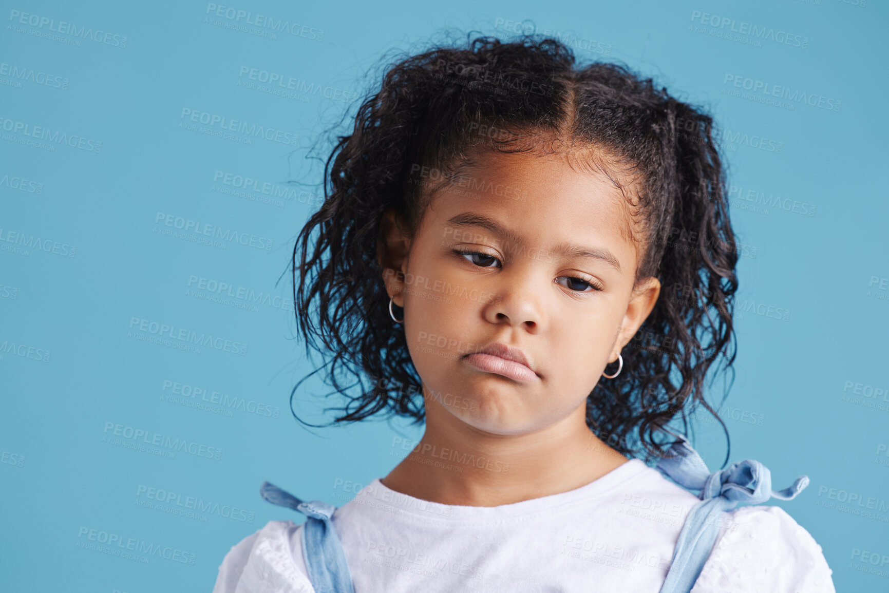 Buy stock photo Sad, girl and child with thinking in studio with depression, unhappy and moody for mental health by space. Person, kid and thoughtful face for attention, grumpy and drama on blue background.