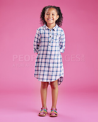 Buy stock photo Girl, child and fashion in studio portrait with smile, pride and confidence for style by pink background. Kid, happy and trendy clothes with check pattern, excited and casual dress in Costa Rica