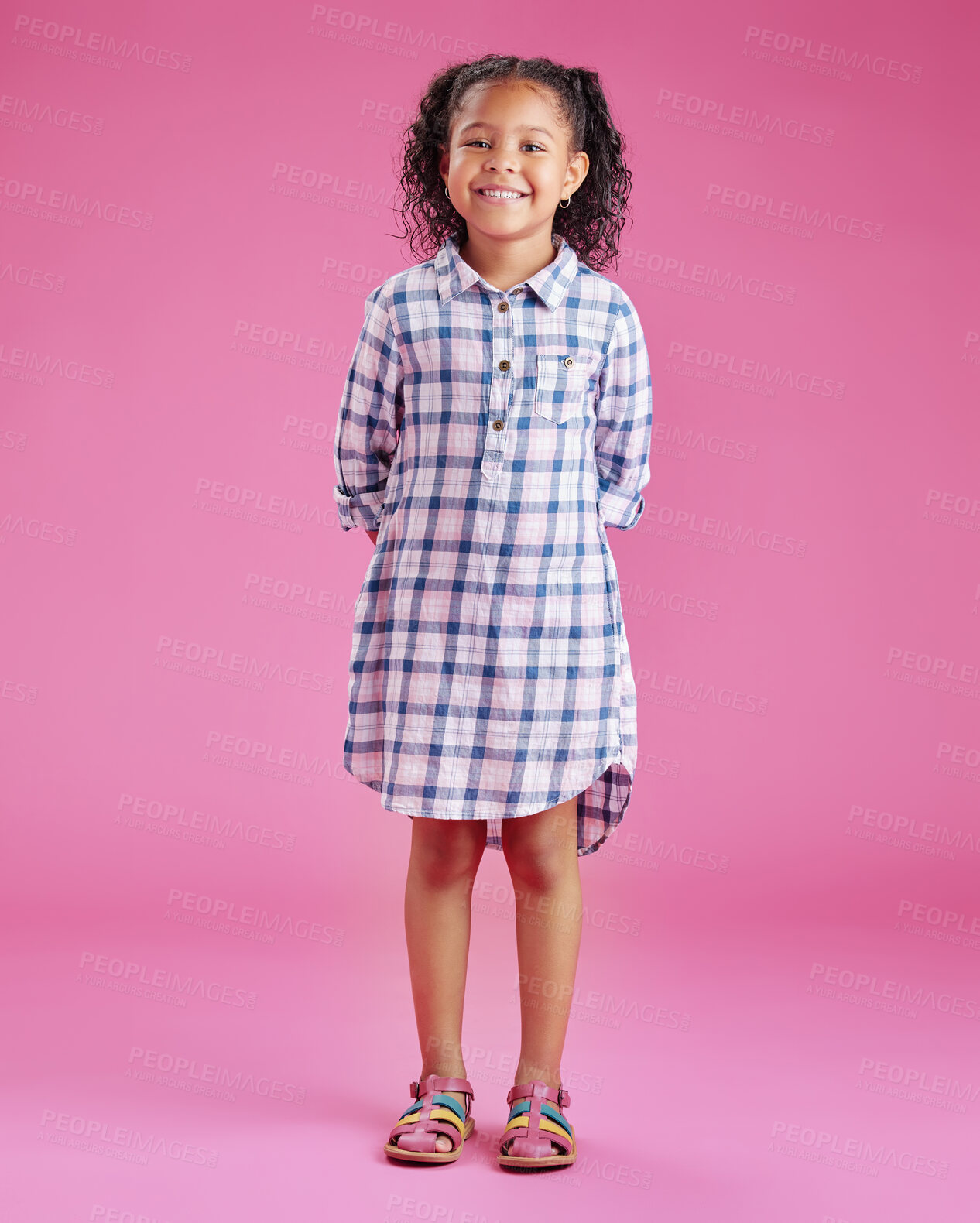 Buy stock photo Girl, child and fashion in studio portrait with smile, pride and confidence for style by pink background. Kid, happy and trendy clothes with check pattern, excited and casual dress in Costa Rica