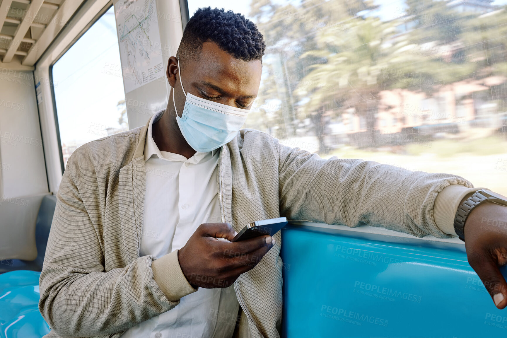 Buy stock photo Train, phone and African businessman with mask for public transport, journey and trip to work. Passenger, smartphone and person on social media on subway, metro railway and travel for morning commute